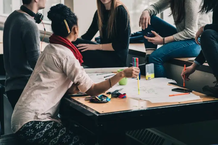 Students studying together around a table