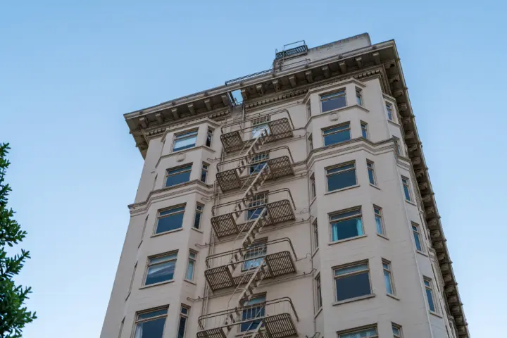 Residential apartment building against a blue sky